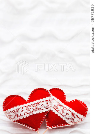 Two red felt hearts with laces, symbol of love Two red felt hearts with laces, symbol of love 36771939
