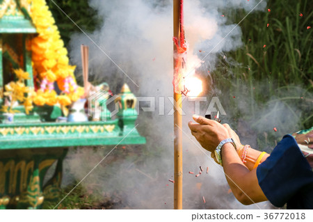 Asian people and firecracker pay respect to shrine Asian people and firecracker pay respect to shrine 36772018