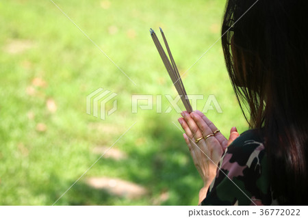 Asian people with incense pay respect to shrine Asian people with incense pay respect to shrine 36772022