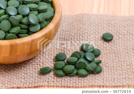 green pills spirulina and chlorella seaweed close green pills spirulina and chlorella seaweed close 36772619