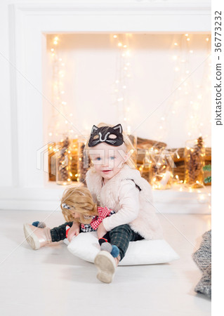 portrait beautiful little girl near the fireplace 36773232