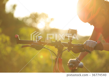 cyclist mount the action camera on mountain bike cyclist mount the action camera on mountain bike 36774540
