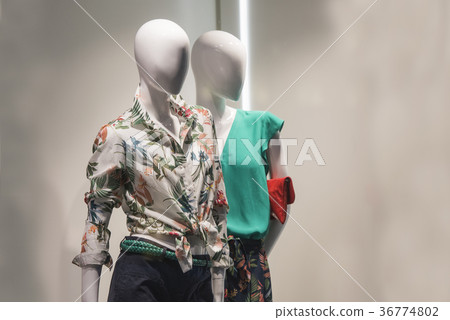 Mannequins in a showcase of a store in Paris. Mannequins in a showcase of a store in Paris. 36774802