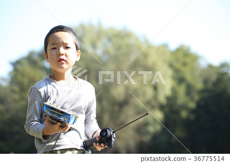 Children playing with radio control 36775514