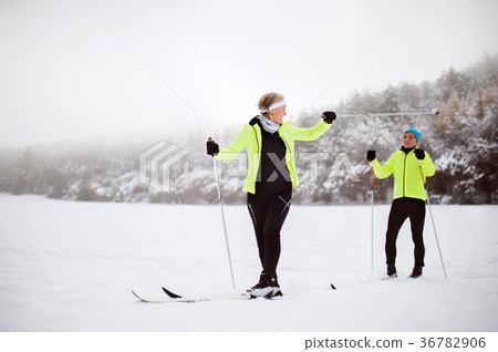 Senior couple cross-country skiing. Senior couple cross-country skiing. 36782906