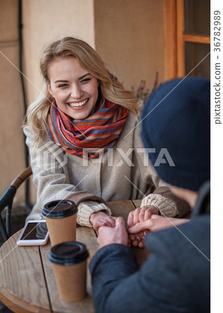 Boy and girl enjoying time outdoors with tea 36782989