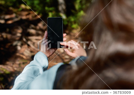 Girl Hand holding blank screen mobile phone in 36783009