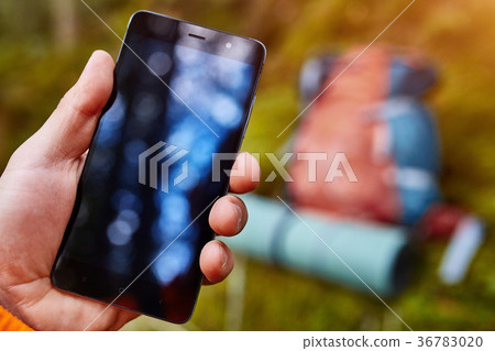 Hand of young man, which is standing on the rock Hand of young man, which is standing on the rock 36783020