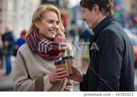 Lovely couple warming up by hot drink 36783021