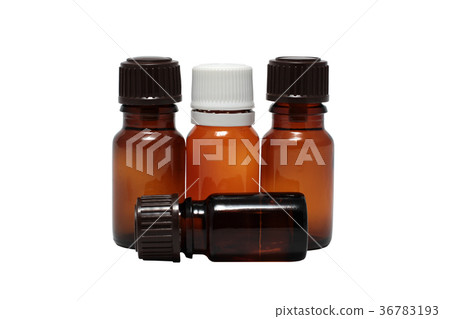 four bottles of aromatherapy oils isolated four bottles of aromatherapy oils isolated 36783193