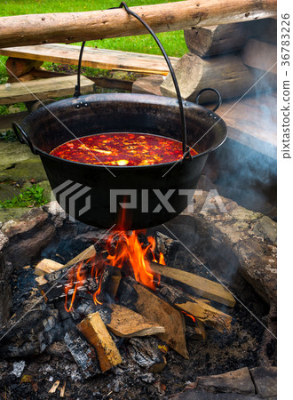 traditional Hungarian Goulash soup in cauldron 36783226