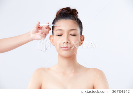 Beautiful woman on isolated White background 36784142