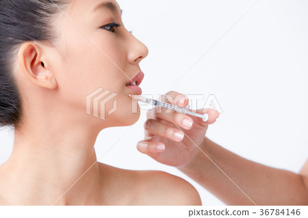 Beautiful woman on isolated White background 36784146