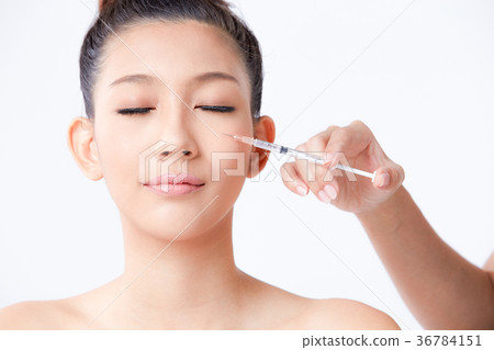 Beautiful woman on isolated White background 36784151