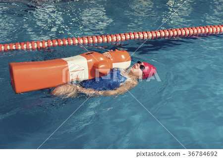 One Girl with Training Dummy in a Pool One Girl with Training Dummy in a Pool 36784692