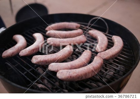 Sausages on grill 36786721