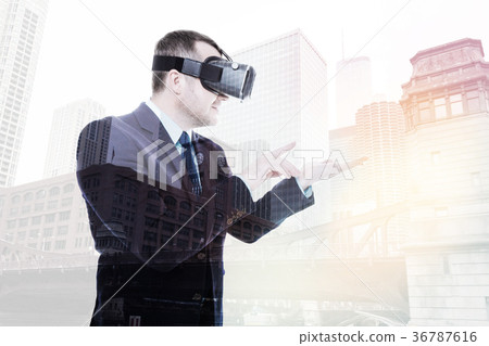 Smiling businessman interacting with VR object on 36787616
