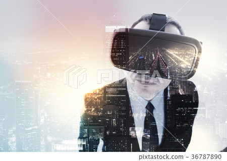 Businessman in VR headset looking at camera 36787890