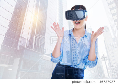 Cheerful woman being excited to play with VR 36787927