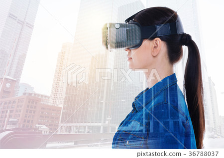 Side view of charming woman in VR headset Side view of charming woman in VR headset 36788037