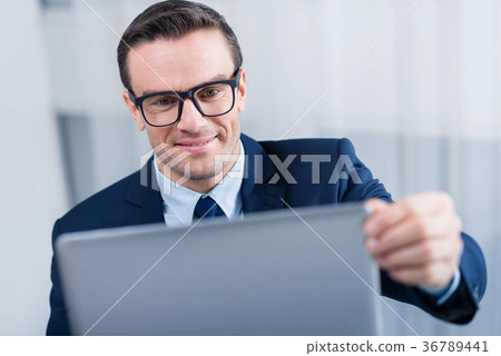 Gay jolly man opening laptop Gay jolly man opening laptop 36789441