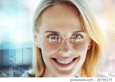 Young happy woman smiling and feeling good herself Young happy woman smiling and feeling good herself 36790175