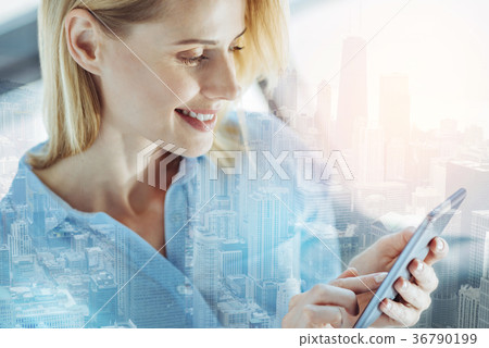 Pretty satisfied woman messaging and smiling. Pretty satisfied woman messaging and smiling. 36790199
