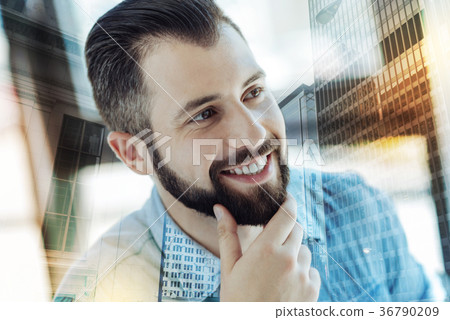 Young perspective man holding hand near beard and 36790209