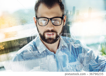 Handsome unshaken man observing something Handsome unshaken man observing something 36790235