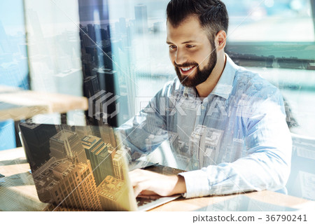 Handsome beardful man working with computer and Handsome beardful man working with computer and 36790241