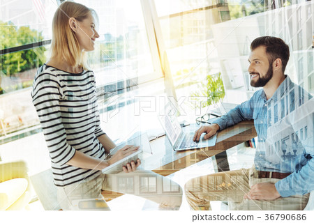 Pretty nice-looking woman sitting and looking at Pretty nice-looking woman sitting and looking at 36790686