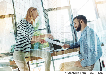Two perspective confident office workers sitting Two perspective confident office workers sitting 36790687