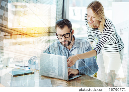 Stylish nice-looking colleagues working and using Stylish nice-looking colleagues working and using 36790771