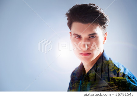 Creative young man imagining a forest 36791543