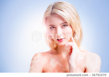 Delighted good looking woman touching her cheek Delighted good looking woman touching her cheek 36792070