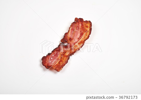Three cooked, crispy fried bacon isolated on a Three cooked, crispy fried bacon isolated on a 36792173