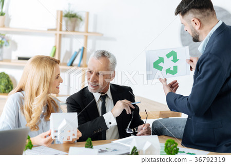 Smart engineers discussing recyclable materials 36792319