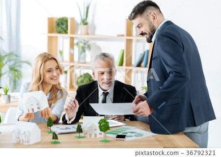 Cheerful realtors smiling while being satisfied 36792321