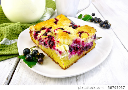 Pie with black currant in plate on light board Pie with black currant in plate on light board 36793037