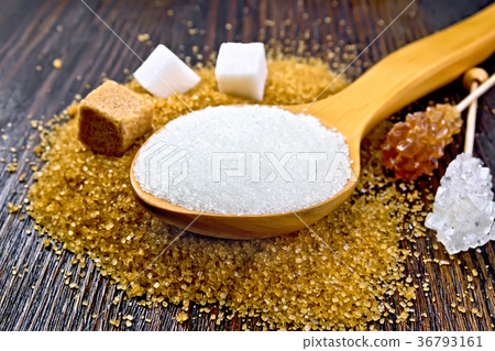 Sugar white and brown different on dark board Sugar white and brown different on dark board 36793161