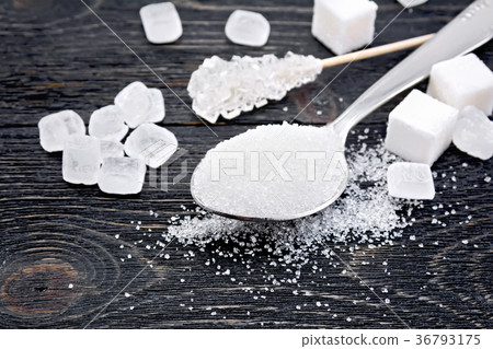 Sugar white in spoon on black board Sugar white in spoon on black board 36793175