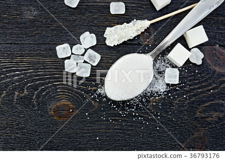 Sugar white in spoon on board top Sugar white in spoon on board top 36793176