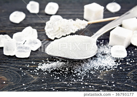 Sugar white in spoon on board Sugar white in spoon on board 36793177