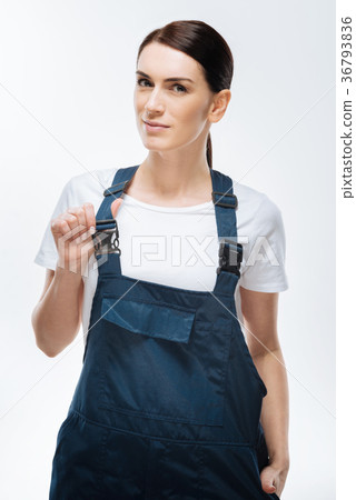 Cunning female architect wearing coveralls Cunning female architect wearing coveralls 36793836