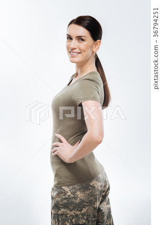 Brunette female soldier posing in camouflage Brunette female soldier posing in camouflage 36794251