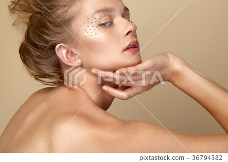 Portrait of cute blonde girl with art makeup 36794582