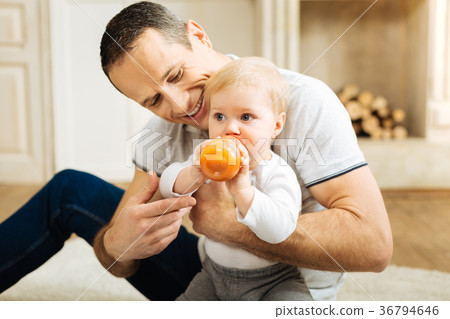 Delighted emotional father feeling happy while Delighted emotional father feeling happy while 36794646