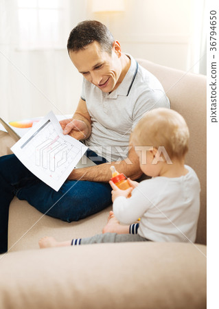 Smart emotional father showing his graphic to a Smart emotional father showing his graphic to a 36794650