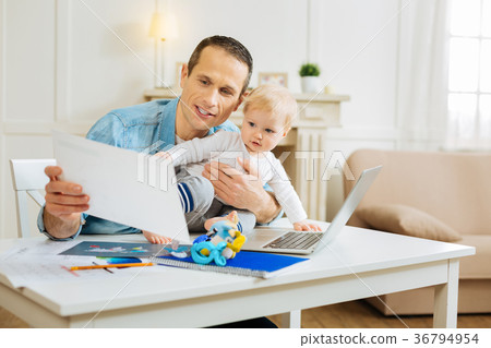Serious attentive man showing his project to a Serious attentive man showing his project to a 36794954