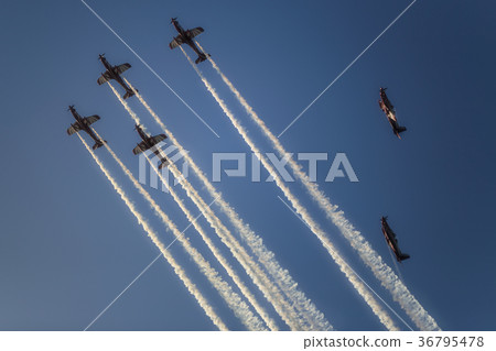Reactive jet plane flying in formation on blue sky 36795478